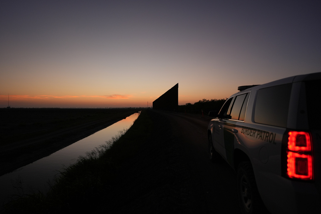 A U.S. Border Patrol vehicle sits near a new section of border wall at the Santa Ana Wildlife Refuge in Alamo, Texas, Tuesday, Aug. 25, 2026. (AP Photo/Eric Gay)