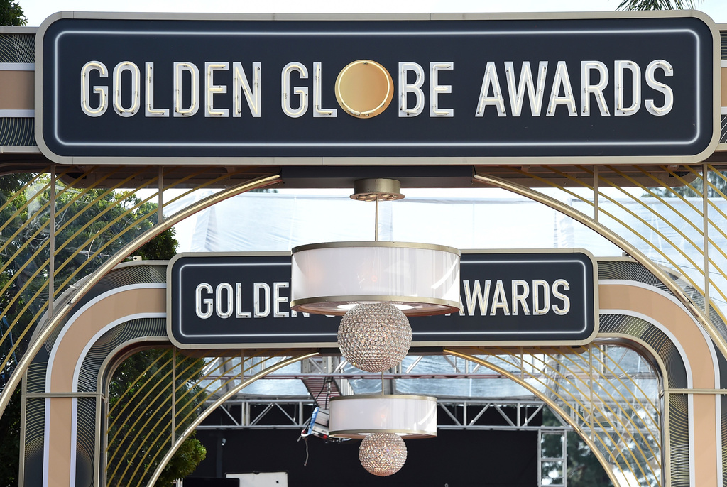 FILE - Event signage appears above the red carpet at the 77th annual Golden Globe Awards, Sunday, Jan. 5, 2020, in Beverly Hills, Calif. (Photo by Jordan Strauss/Invision/AP, File)