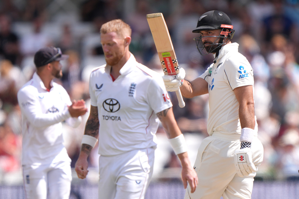 New Zealand's Daryl Mitchell, right, celebrates reaching a half century on day four of the Third Rothesay Test in Nottingham, England, Sunday, June 28, 2026. (Joe Giddens/PA via AP)