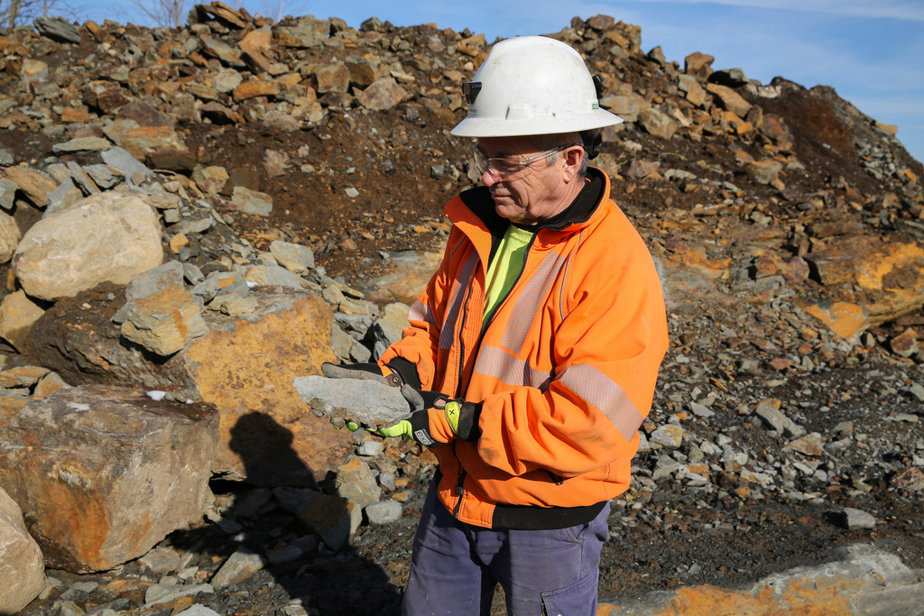 Joel Rheault, vice president of operations for Titan Mining Corp., holds a rock containing graphite at a mine, Nov. 20, 2025, in Gouverneur, N.Y. (AP Photo/Michael Hill)