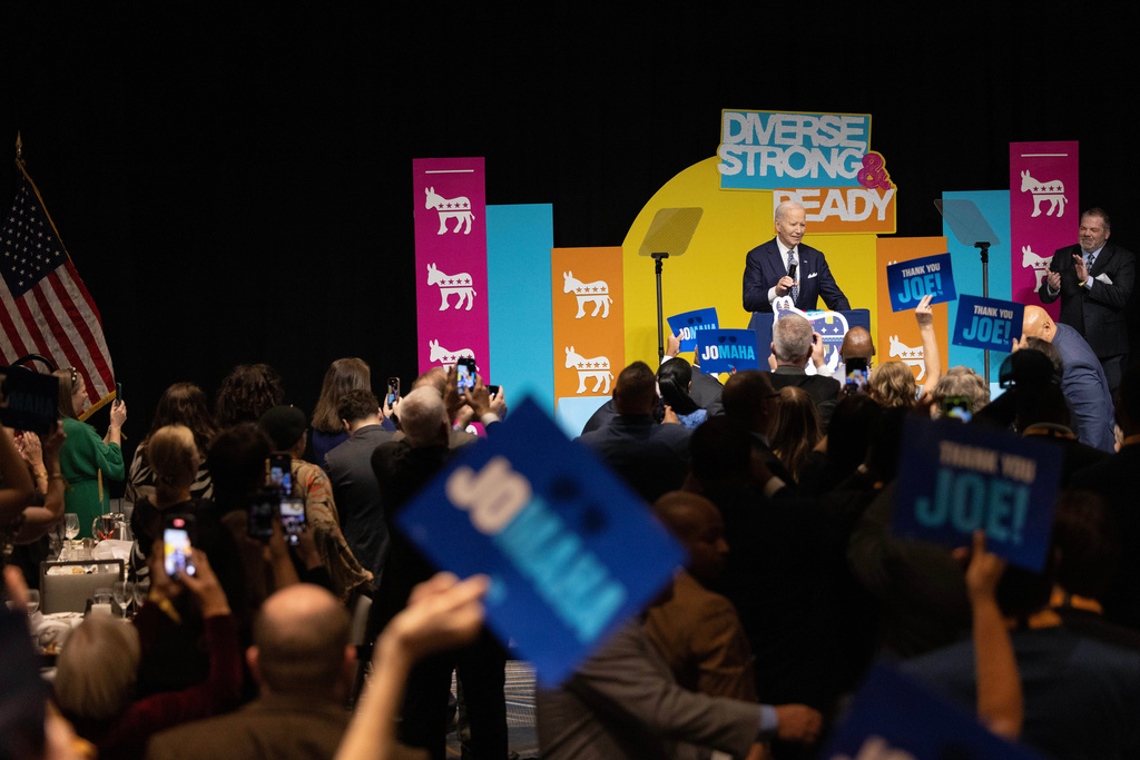 Former President Joe Biden takes the podium to a standing ovation during the Ben Nelson Gala, Friday, Nov. 7, 2025, in Omaha, Neb. (AP Photo/Rebecca S. Gratz)