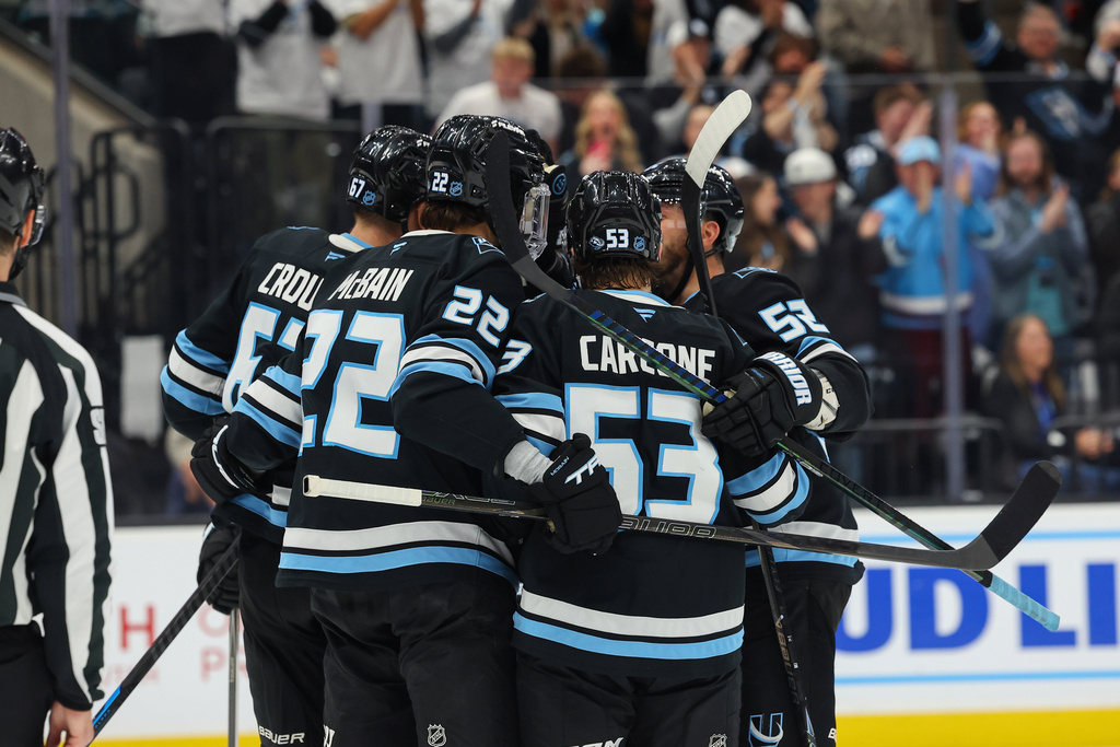 Utah Mammoth celebrate the goal against the Edmonton Oilers during the second period of an NHL hockey game, Tuesday, March 24, 2026, in Salt Lake City. (AP Photo/Melissa Majchrzak)