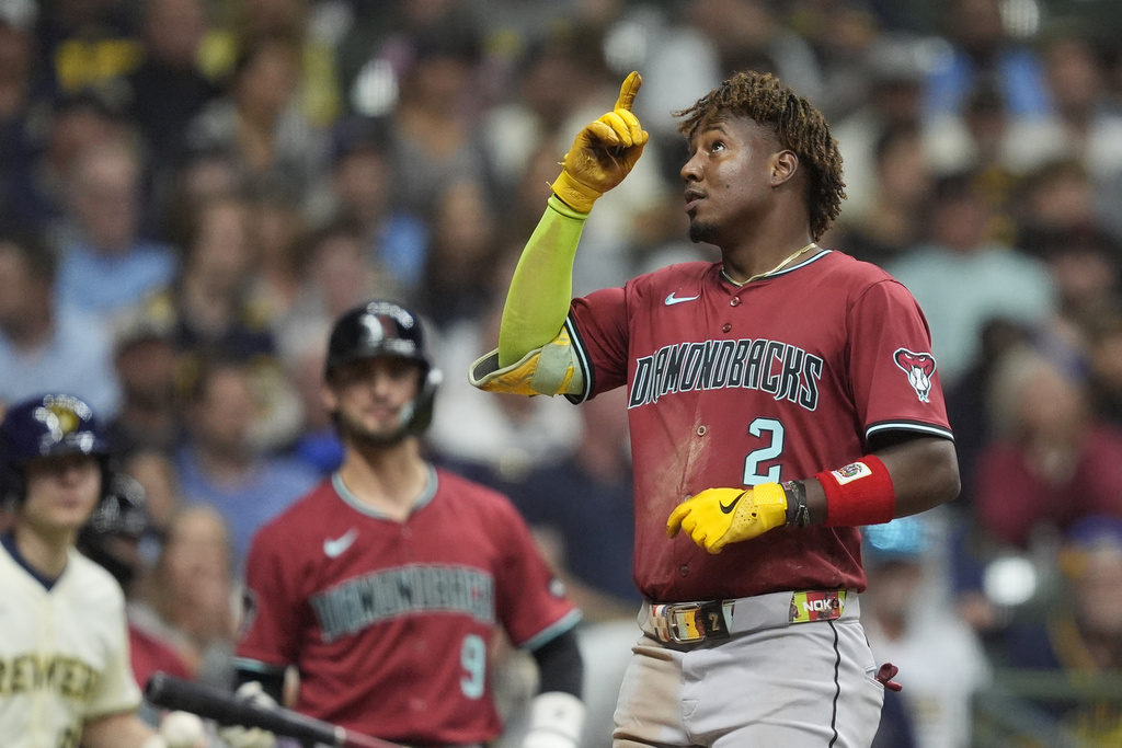 Arizona Diamondbacks' Geraldo Perdomo (2) gestures after hitting a solo home run during the eighth inning of a baseball game against the Milwaukee Brewers, Wednesday, Aug. 27, 2025, in Milwaukee. (AP Photo/Aaron Gash)