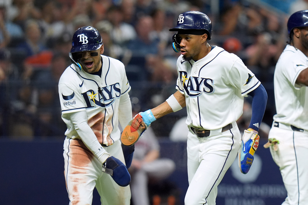 Tampa Bay Rays' Chandler Simpson, right, and Victor Mesa Jr. celebrate after scoring on a two-run single by Richie Palacios off Houston Astros pitcher Peter Lambert during the fifth inning of a baseball game Saturday, Sept. 12, 2026, in St. Petersburg, Fla. (AP Photo/Chris O'Meara)