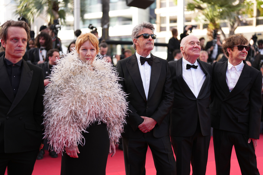 August Diehl, Sandra Hüller, Pawel Pawlikowski, Hanns Zischler and Lukasz Zal pose for photographers upon arrival at the premiere of the film 'Fatherland' at the 79th international film festival, Cannes, southern France, Thursday, May 14, 2026. (Photo by Scott A Garfitt/Invision/AP)