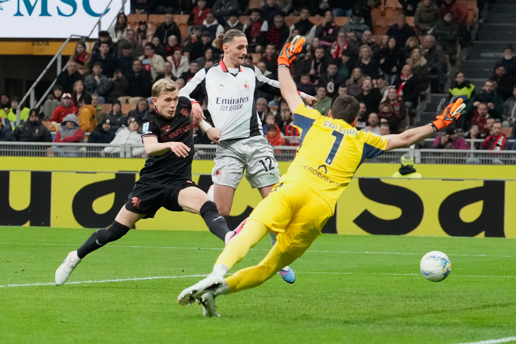 AC Milan's Adrien Rabiot, center, scores his side's second goal during the Serie A soccer match between AC Milan and Torino, in Milan, Italy, Saturday, March 21, 2026. (AP Photo/Luca Bruno)