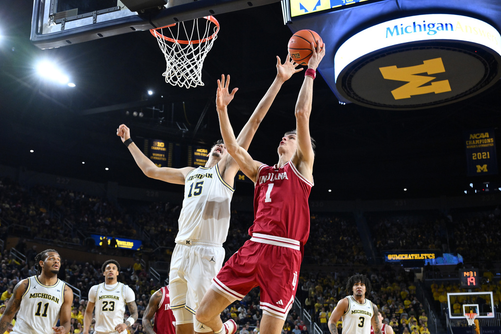 Indiana Hoosiers forward Reed Bailey (1) shoots the ball over Michigan Wolverines center Aday Mara (15) in the first half of an NCAA college basketball game, Tuesday, Jan. 20, 2026, in Ann Arbor, Mich.,(AP Photo/Lon Horwedel)