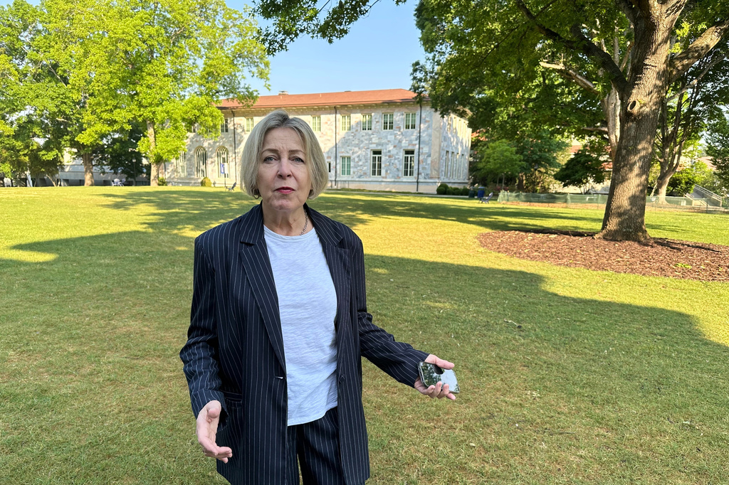 Noelle McAfee, an Emory University professor, talks about her lawsuit against the school over her 2024 arrest at a protest over the Israel-Hamas war on Thursday, April 23, 2026, on the Emory University campus in Atlanta. (AP Photo/Jeff Amy)
