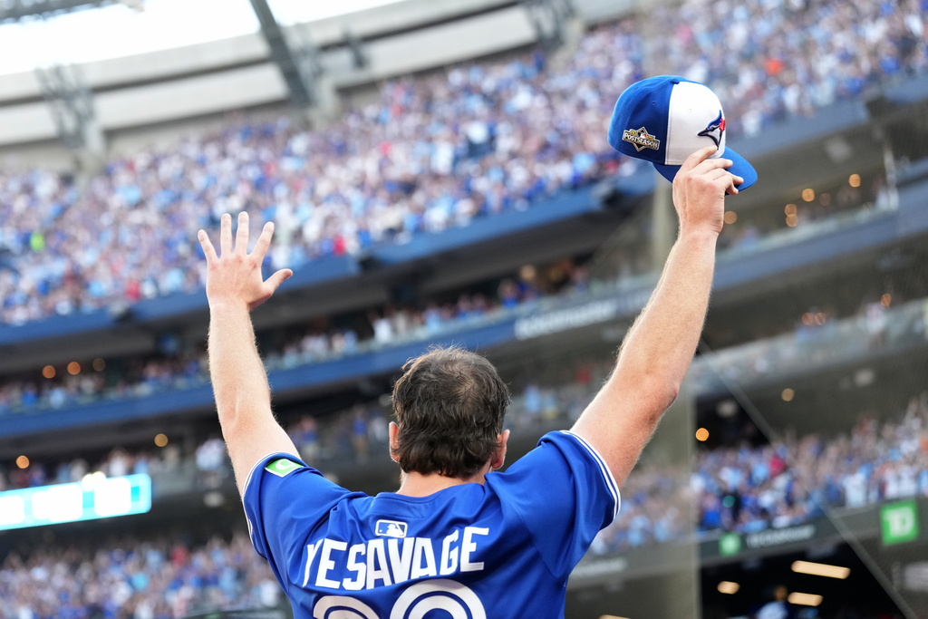 CORRECTS TO SIXTH INNING NOT FIFTH INNING - Toronto Blue Jays pitcher Trey Yesavage comes out to a standing ovation as he greets fans after he was pulled from the mound during the sixth inning of Game 2 of baseball's American League Division Series in Toronto, Sunday, Oct. 5, 2025. (Nathan Denette/The Canadian Press via AP)