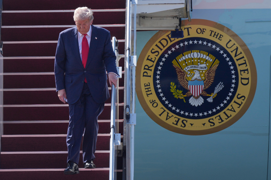 President Donald Trump walks down the stairs of Air Force One as he arrives at Kuala Lumpur International Airport in Sepang, Malaysia, Sunday, Oct. 26, 2025. (AP Photo/Mark Schiefelbein)