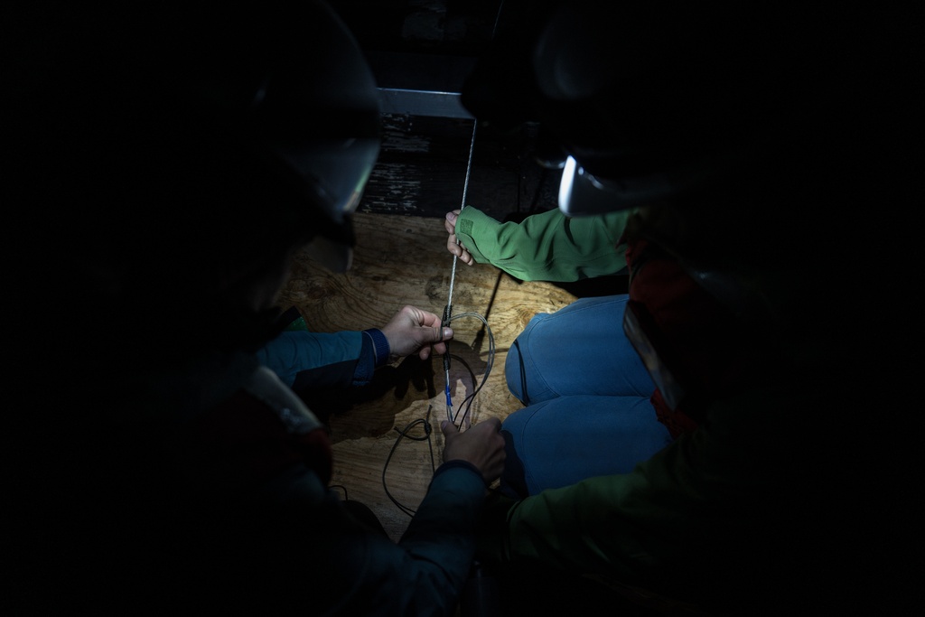 Researchers from the University of Washington prepare to deploy a 1.3-mile fiber-optic cable to test whether internet cables can detect endangered orca vocalizations near San Juan Island, Wash., Friday, Oct. 10, 2025. (AP Photo/Annika Hammerschlag)
