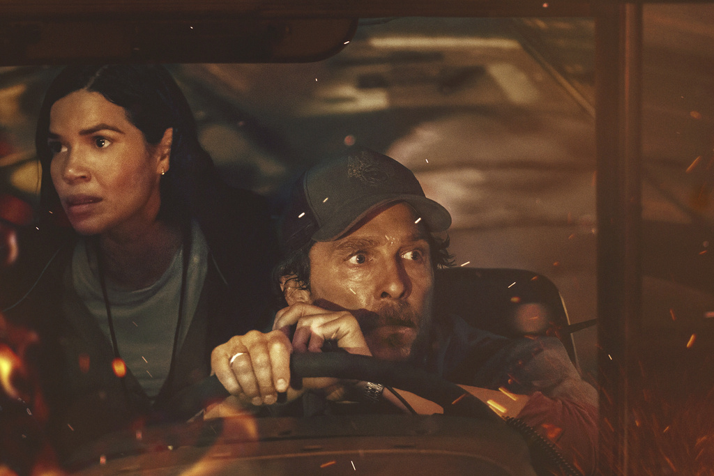 This image released by Apple TV+ shows America Ferrara, left, and Matthew McConaughey in a scene from "The Lost Bus." (Apple TV+ via AP)