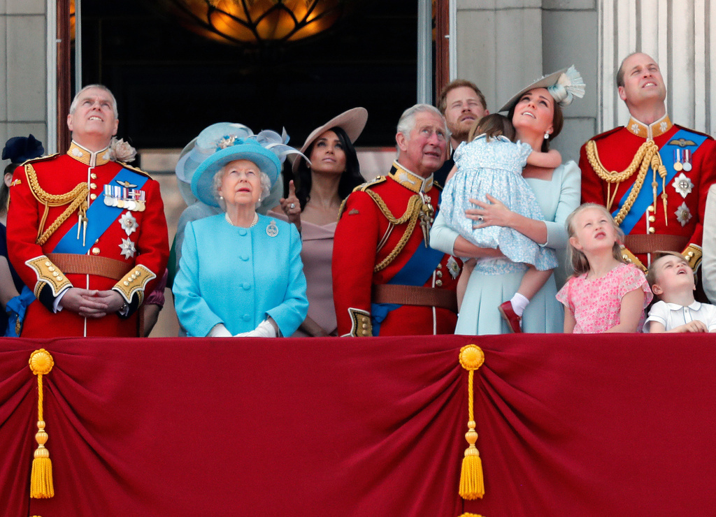 FILE - From left, Britain's Prince Andrew, Queen Elizabeth, Meghan Duchess of Sussex, Prince Charles, Prince Harry, Kate Duchess of Cambridge and Prince William attend the annual Trooping the Colour Ceremony in London, Saturday, June 9, 2018.(AP Photo/Frank Augstein, File)
