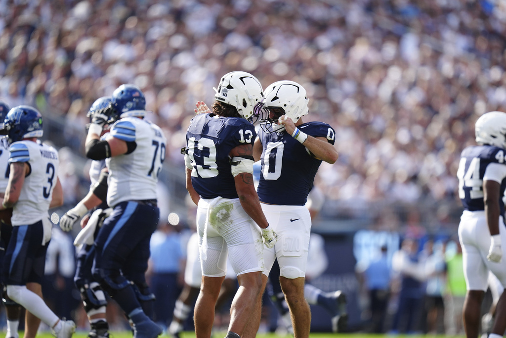 Penn State linebacker Tony Rojas (13) and linebacker Dominic DeLuca (0) celebrate a tackle during the first half of an NCAA college football game against Villanova, Saturday, Sept. 13, 2025, in State College, Pa. (AP Photo/Jared Freed)