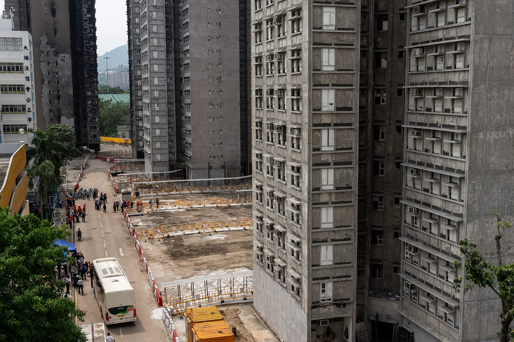 Residents of Wang Fuk Court return to their flats and retrieve belongings five months after a deadly fire in Hong Kong Monday, April 20, 2026. (AP Photo/Chan Long Hei)