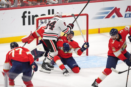 Florida Panthers center Evan Rodrigues (17) reacts to an apparent injury as he clashes with Chicago Blackhawks center Sam Lafferty (24) in front of Florida Panthers goaltender Sergei Bobrovsky (72) during the second period of an NHL hockey game, Tuesday, Oct. 7, 2025, in Sunrise, Fla. (AP Photo/Rebecca Blackwell) Florida Panthers center Evan Rodrigues (17) reacts to an apparent injury as he clashes with Chicago Blackhawks center Sam Lafferty (24) in front of Florida Panthers goaltender Sergei Bobrovsky (72) during the second period of an NHL hockey game, Tuesday, Oct. 7, 2025, in Sunrise, Fla. (AP Photo/Rebecca Blackwell)