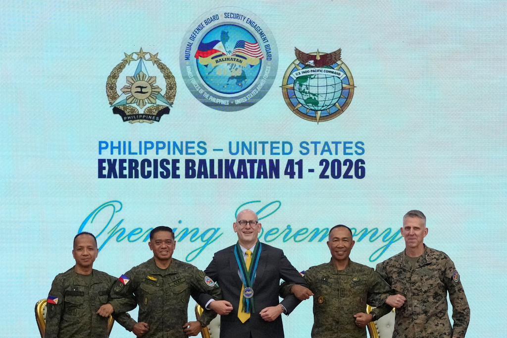 From left, Major General Francisco Lorenzo Jr., Philippine exercise director, Philippine military Chief General Romeo Brawner, U.S. Charge d' Affaires, Ad interim Y. Robert Ewing, Philippine Deputy Chief of Staff for Operations J3 Major General Elmer Suderio and US Lieutenant General Christian Wortman, Commanding General I Marine Expeditionary Force, pose during the opening ceremonies of the joint military exercise dubbed "Balikatan" or "Shoulder to Shoulder", Monday, April 20, 2026, at Camp Aguinaldo military headquarters in Quezon city, Philippines. (AP Photo/Aaron Favila)