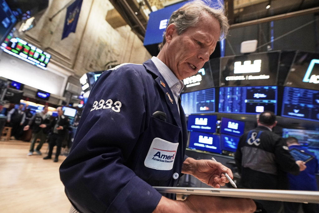 Trader Robert Charmak works on the floor of the New York Stock Exchange, Monday, Nov. 24, 2025. (AP Photo/Richard Drew)