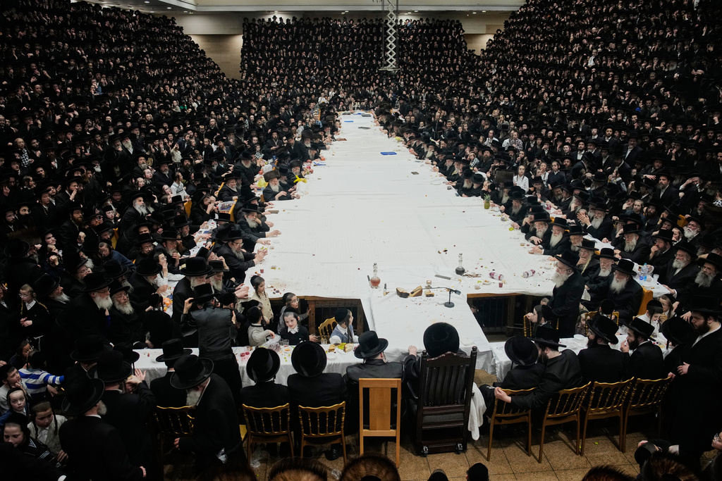 Ultra-Orthodox Jews from the Belz Hasidic dynasty celebrate the Jewish holiday of Tu Bishvat, the "New Year of the Trees," in Jerusalem, Monday, Feb. 2, 2026. (AP Photo/Ohad Zwigenberg)