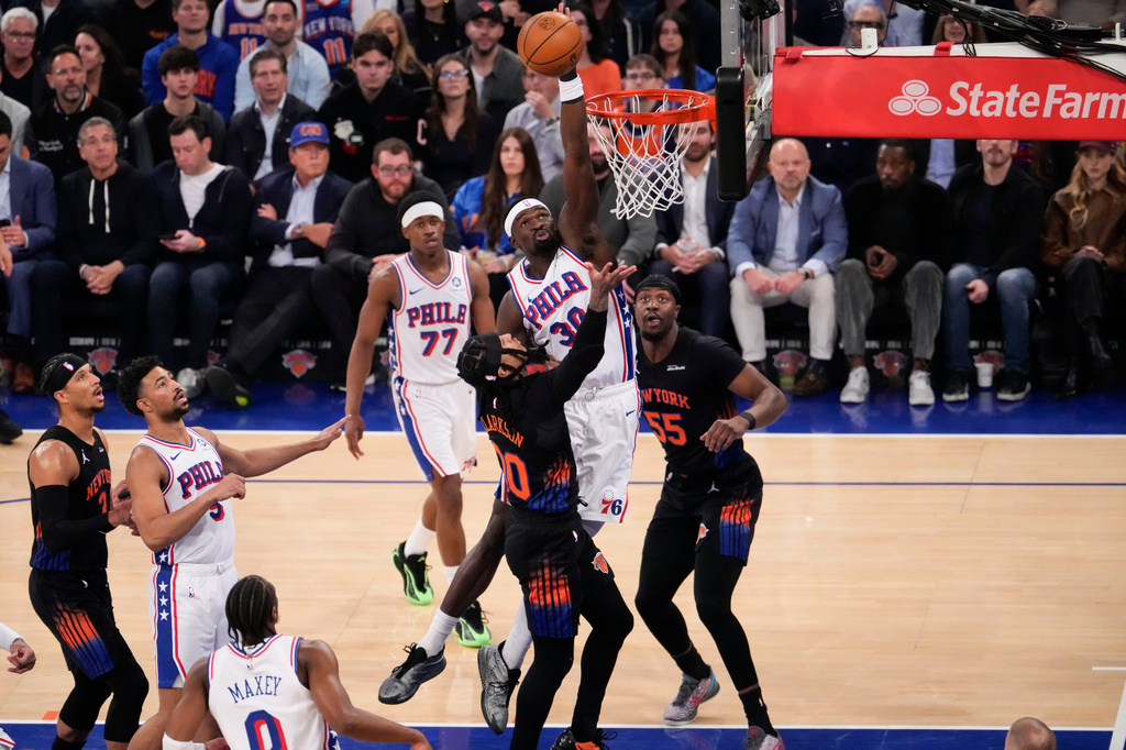 Philadelphia 76ers center Adem Bona (30) blocks New York Knicks guard Jordan Clarkson (00) during the first half of Game 2 in a second-round NBA basketball playoffs series, Wednesday, May 6, 2026, in New York. (AP Photo/Yuki Iwamura)