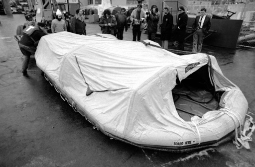 FILE - Two U.S. Coast Guardsmen move a life raft from the freighter Edmund Fitzgerald across the dock in Sault Ste. Marie, Mich. Nov. 11, 1975, after the raft was plucked from Whitefish Bay by the freighter Roger Blough, a ship assisting in the search for the missing Edmund Fitzgerald, which sunk on Nov. 10, 1975, in Lake Superior. (AP photo/JCH, file) FILE - Two U.S. Coast Guardsmen move a life raft from the freighter Edmund Fitzgerald across the dock in Sault Ste. Marie, Mich. Nov. 11, 1975, after the raft was plucked from Whitefish Bay by the freighter Roger Blough, a ship assisting in the search for the missing Edmund Fitzgerald, which sunk on Nov. 10, 1975, in Lake Superior. (AP photo/JCH, file)