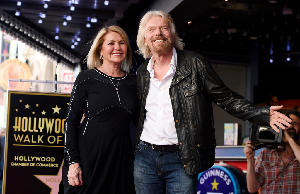 FILE - British business magnate Richard Branson, right, appears with his wife Joan Templeman Branson during a ceremony honoring him with a star on the Hollywood Walk of Fame, in Los Angeles, Oct. 16, 2018. (Photo by Chris Pizzello/Invision/AP, File)