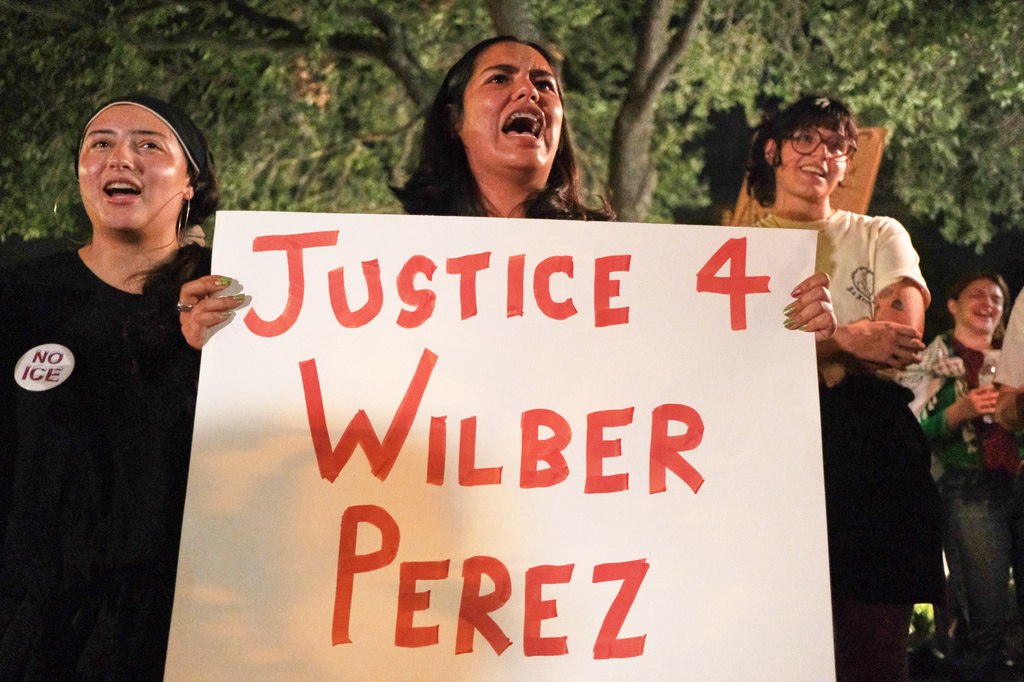 Demonstrators gather in response to the shooting of Wilber Rafael Garces Perez, a Venezuelan man who was shot in his vehicle by an ICE officer the previous day in Austin, Texas, Monday, Sept. 21, 2026. (AP Photo/Joel Angel Juarez)