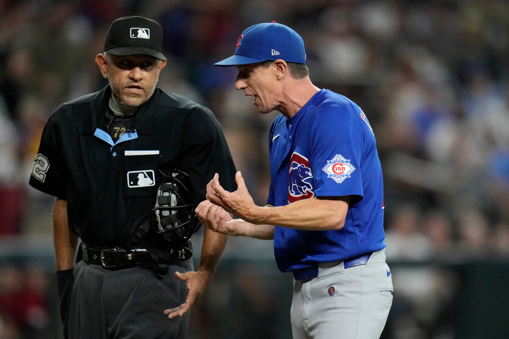 Chicago Cubs manager Craig Counsell, right, argues with home plate umpire Alfonso Márquez during the sixth inning of a baseball game against the Arizona Diamondbacks, Wednesday, Aug. 26, 2026, in Phoenix. (AP Photo/Ross D. Franklin)