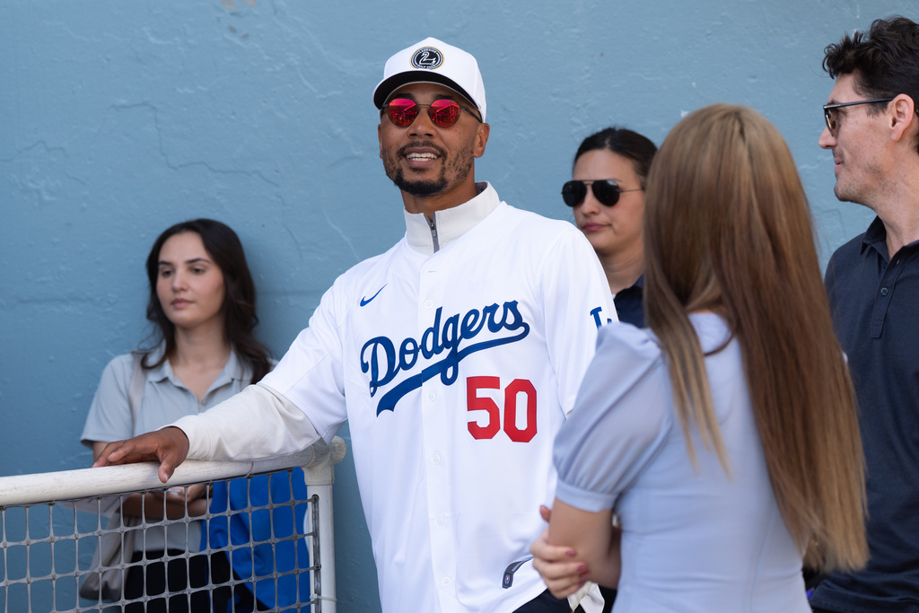 Los Angeles Dodgers shortstop Mookie Betts waits to talk to reporters during DodgerFest at Dodger Stadium in Los Angeles, Saturday, Jan. 31, 2026. (AP Photo/Jae C. Hong)