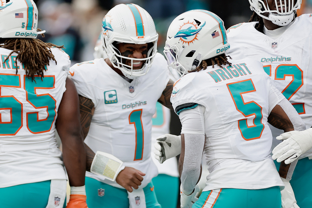 Miami Dolphins quarterback Tua Tagovailoa (1) reacts during the first quarter of an NFL football game against the New York Jets, Sunday, Dec. 7, 2025, in East Rutherford, N.J. (AP Photo/Adam Hunger)