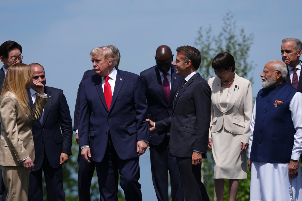 From left, South Korea's President Lee Jae Myung, Italian Prime Minister Giorgia Meloni, Egyptian President Abdel-Fattah el Sissi, U.S. President Donald Trump, Kenya's President William Ruto, French President Emmanuel Macron Japan's Prime Minister Sanae Takaichi, India's Prime Minister Narenda Modi and Canadian Prime Minister Mark Carney during a group photo of G7 leaders and invited nations during the G7 summit in Evian-les-Bains, France, Tuesday, June 16, 2026. (AP Photo/Thibault Camus)