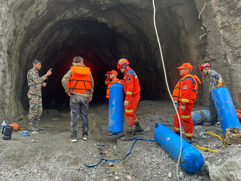 This photo provided by the Nepal Army, shows Nepal army soldiers undertake rescue operation at the site of a hydropower project in Upper Trishuli, Nepal, Monday, Aug. 31, 2026. (Nepal Army via AP)