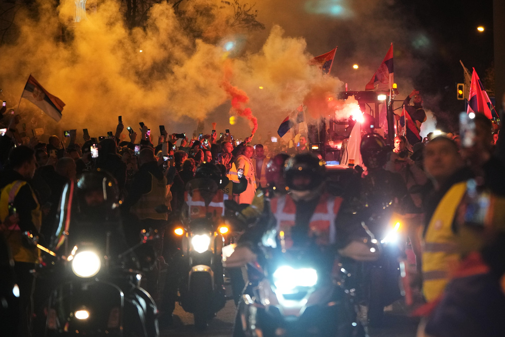 People welcome a group of students from the southwestern town of Novi Pazar as they march towards the northern city of Novi Sad, for a huge rally on Nov. 1 marking the first anniversary of a train station disaster that killed 16 people, in Belgrade, Serbia, Tuesday, Oct. 28, 2025. (AP Photo/Darko Vojinovic)