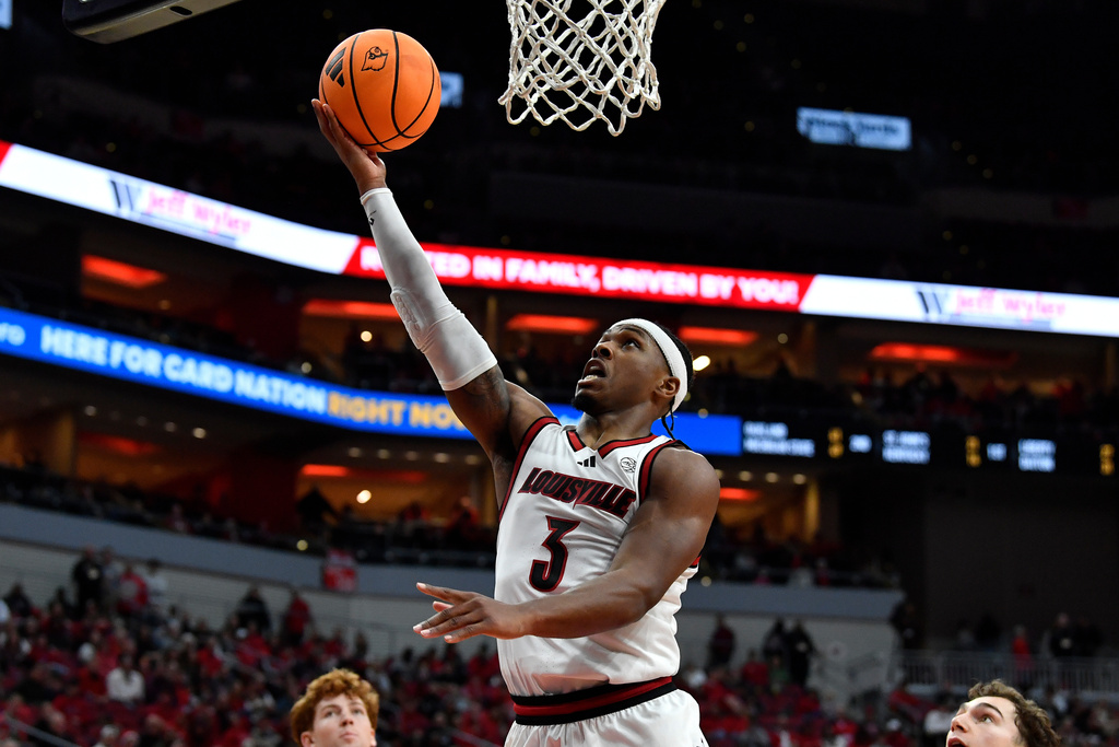Louisville guard Ryan Conwell (3) goes in for a layup during the second half of an NCAA college basketball game against Montana in Louisville, Ky., Saturday, Dec. 20, 2025. (AP Photo/Timothy D. Easley)
