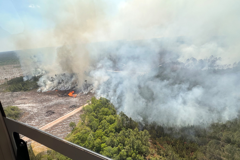 The photo provided by the Office of Gov. Brian Kemp shows smoke produced from a wildfire in Brantley County, Ga., Friday, April 24, 2026. (Office of Gov. Brian Kemp via AP)