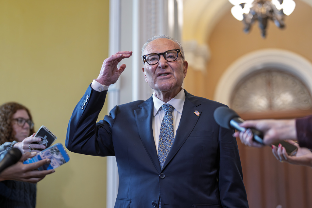 Senate Minority Leader Chuck Schumer, D-N.Y., holds an impromptu news conference with reporters just outside the chamber to say he has filed an amendment on the Senate floor to require the attorney general to release the Epstein files and Republicans will have to vote on it, at the Capitol in Washington, Wednesday, Sept. 10, 2025. (AP Photo/J. Scott Applewhite)