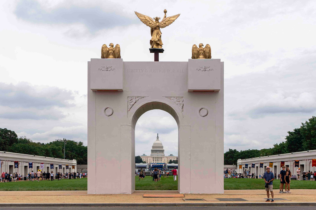 FILE - A mockup of President Donald Trump's proposed triumphal arch stands at the Great American State Fair on the National Mall, June 27, 2026, in Washington. (AP Photo/Jen Golbeck, File)