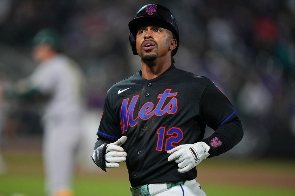 New York Mets' Francisco Lindor (12) reacts after being thrown out at first base during the eighth inning of a baseball game against the Athletics Friday, April 10, 2026, in New York. (AP Photo/Frank Franklin II)