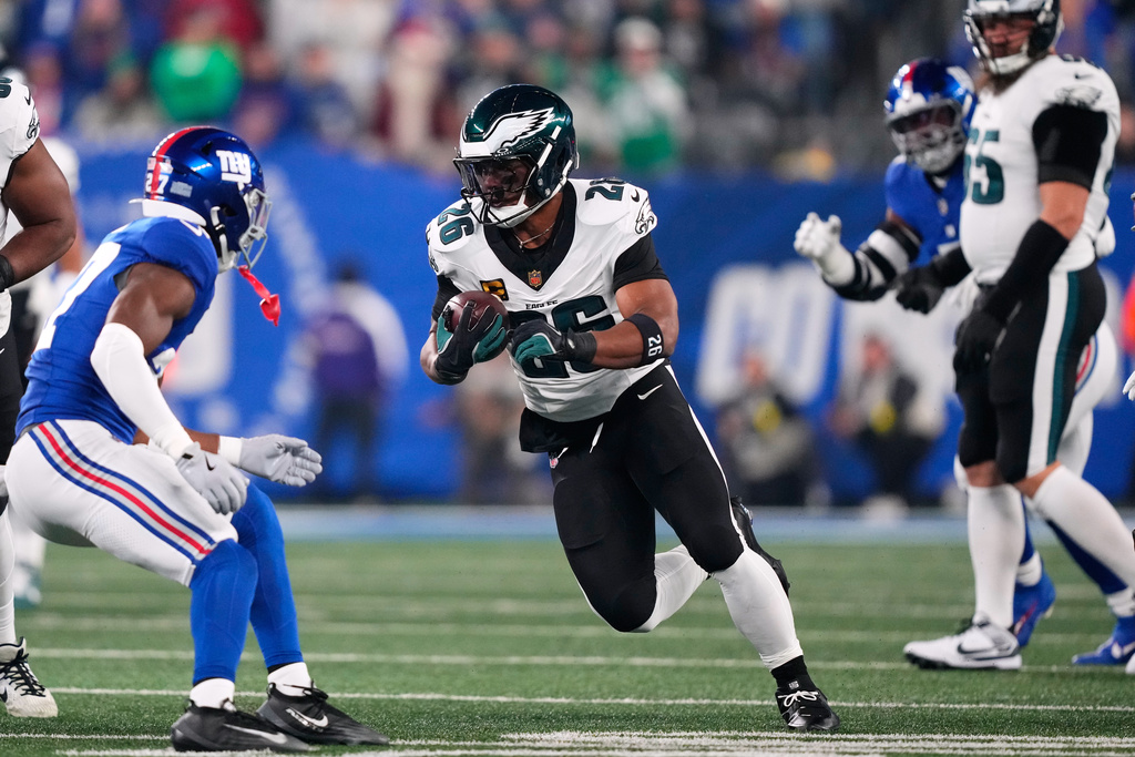 Philadelphia Eagles' Saquon Barkley runs during the first half of an NFL football game against the New York Giants Thursday, Oct. 9, 2025, in East Rutherford, N.J. (AP Photo/Yuki Iwamura)