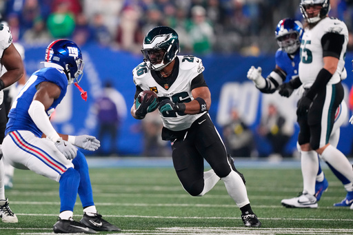 Philadelphia Eagles' Saquon Barkley runs during the first half of an NFL football game against the New York Giants Thursday, Oct. 9, 2025, in East Rutherford, N.J. (AP Photo/Yuki Iwamura) Philadelphia Eagles' Saquon Barkley runs during the first half of an NFL football game against the New York Giants Thursday, Oct. 9, 2025, in East Rutherford, N.J. (AP Photo/Yuki Iwamura)