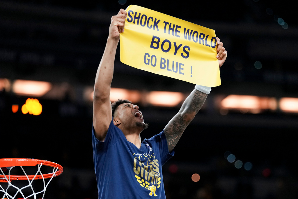 Michigan forward Yaxel Lendeborg celebrates after defeating UConn in the NCAA college basketball tournament national championship game at the Final Four, Monday, April 6, 2026, in Indianapolis. (AP Photo/Abbie Parr)