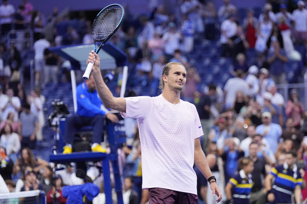 Alexander Zverev, of Germany, acknowledges fans after defeating Lorenzo Sonego, of Italy, in five sets in the first round of the U.S. Open tennis championships early Wednesday, Sept. 2, 2026, in New York. (AP Photo/Frank Franklin II)