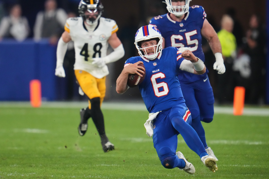 Buffalo Bills quarterback Shane Buechele (6) runs the ball for a short gain in the second half of a preseason NFL football game against the Pittsburgh Steelers in Orchard Park, NY., Thursday, Aug. 27, 2026. (AP Photo/Gene J. Puskar)