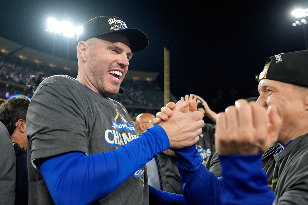 Los Angeles Dodgers first baseman Freddie Freeman celebrates after their win against the Milwaukee Brewers in baseball's National League Championship Series, Friday, Oct. 17, 2025, in Los Angeles. (AP Photo/Brynn Anderson)