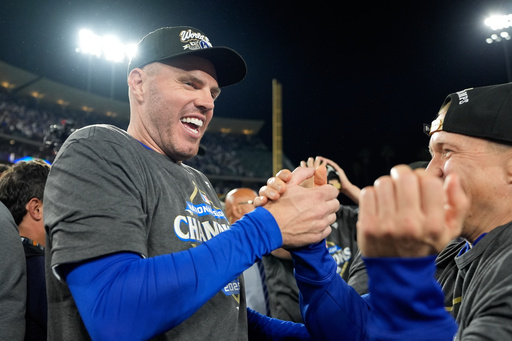 Los Angeles Dodgers first baseman Freddie Freeman celebrates after their win against the Milwaukee Brewers in baseball's National League Championship Series, Friday, Oct. 17, 2025, in Los Angeles. (AP Photo/Brynn Anderson) Los Angeles Dodgers first baseman Freddie Freeman celebrates after their win against the Milwaukee Brewers in baseball's National League Championship Series, Friday, Oct. 17, 2025, in Los Angeles. (AP Photo/Brynn Anderson)