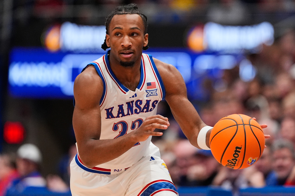 Kansas guard Darryn Peterson drives during the first half of an NCAA college basketball game against Green Bay, Monday, Nov. 3, 2025, in Lawrence, Kan. (AP Photo/Charlie Riedel)
