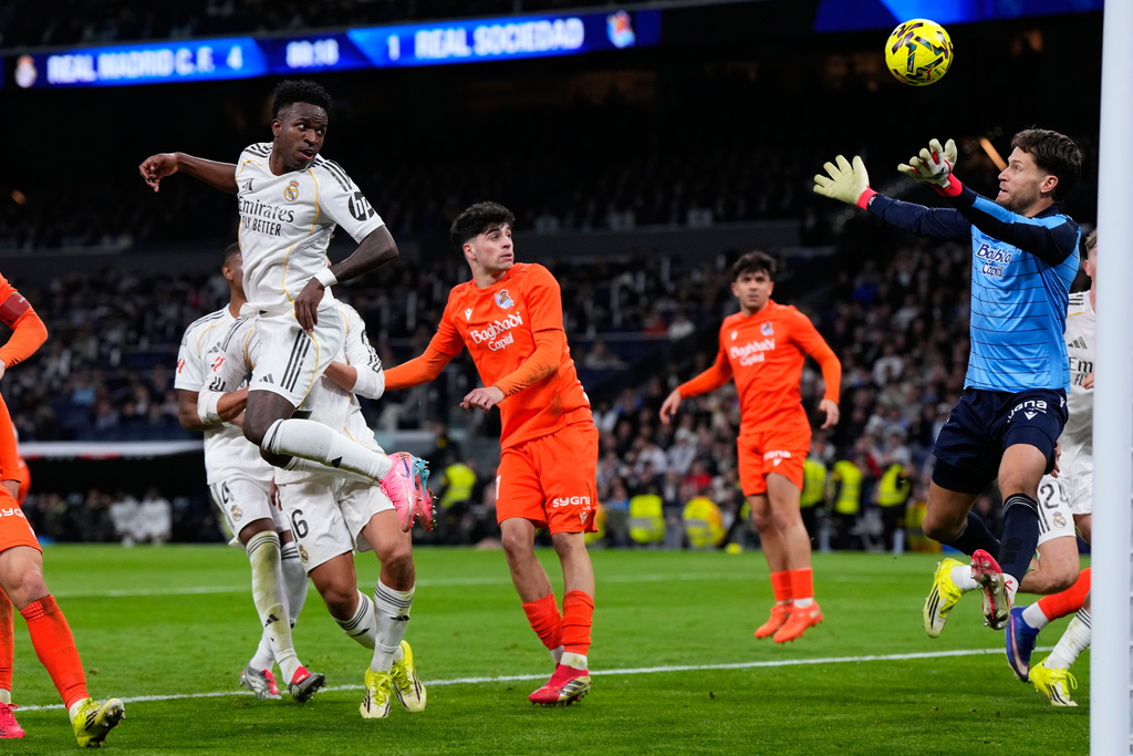Real Madrid's Vinicius Junior, top left, scores a goal that was disallowed by the VAR during the Spanish La Liga soccer match between Real Madrid and Real Sociedad in Madrid, Spain, Saturday, Feb. 14, 2026. (AP Photo/Manu Fernandez)