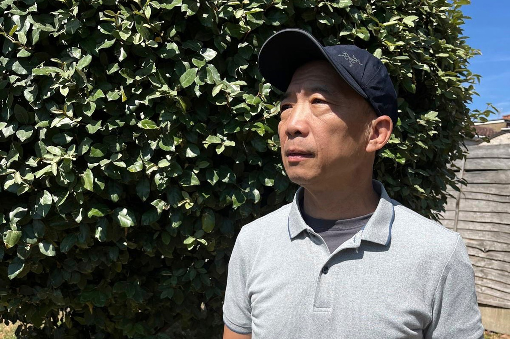 This photo released by Hong Kong's former pro-democracy lawmaker Wu Chi-wai show's himself posing for a portrait in London, Saturday, July 25, 2026. (Wu Chi-wai via AP)