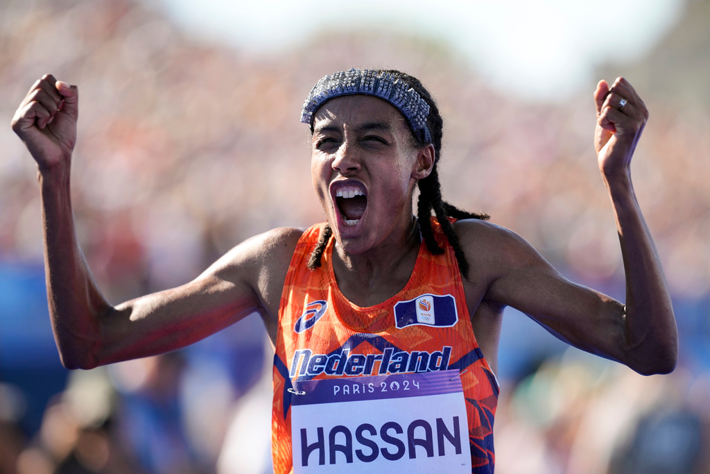 FILE - Sifan Hassan, of the Netherlands, celebrates after crossing the finish line to win the gold medal at the end of the women's marathon competition at the 2024 Summer Olympics, Sunday, Aug. 11, 2024, in Paris, France. (AP Photo/Vadim Ghirda, File)