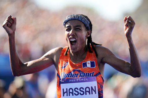 FILE - Sifan Hassan, of the Netherlands, celebrates after crossing the finish line to win the gold medal at the end of the women's marathon competition at the 2024 Summer Olympics, Sunday, Aug. 11, 2024, in Paris, France. (AP Photo/Vadim Ghirda, File) FILE - Sifan Hassan, of the Netherlands, celebrates after crossing the finish line to win the gold medal at the end of the women's marathon competition at the 2024 Summer Olympics, Sunday, Aug. 11, 2024, in Paris, France. (AP Photo/Vadim Ghirda, File)